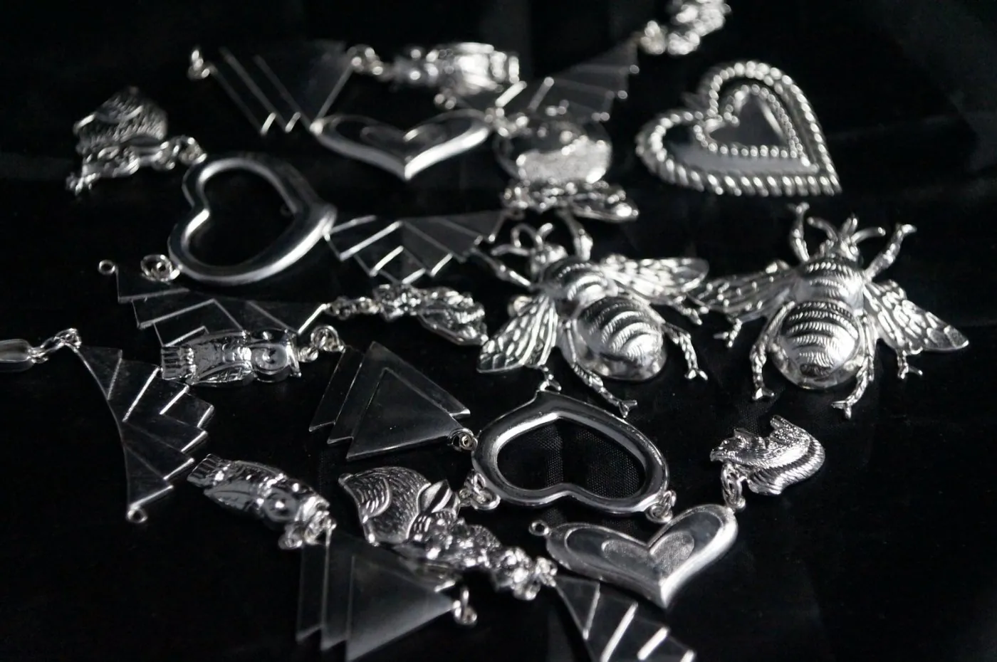 Assorted silver-plated charms, hearts and bees